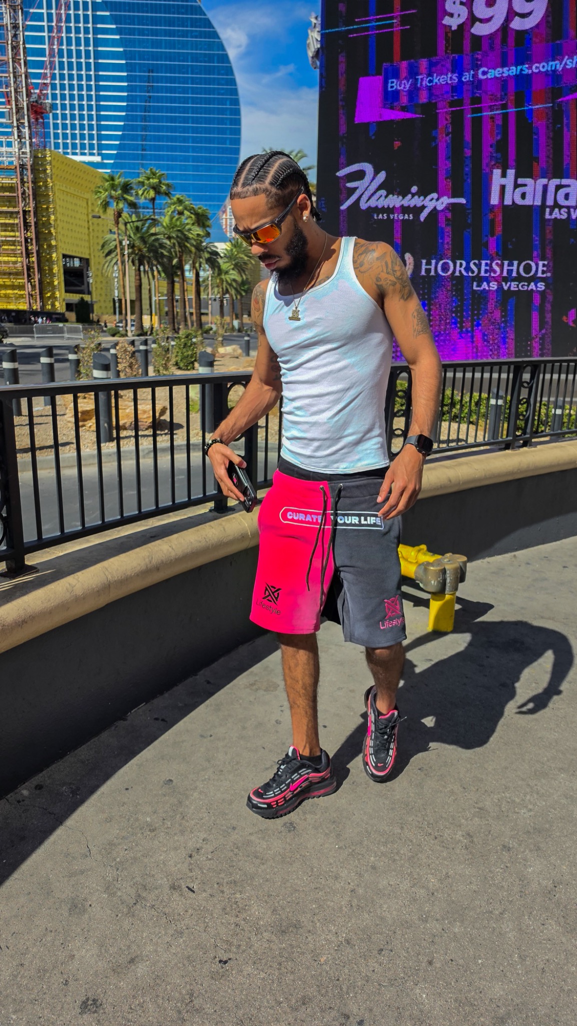 XO Lifestyle magenta and black two face shorts worn in Las Vegas